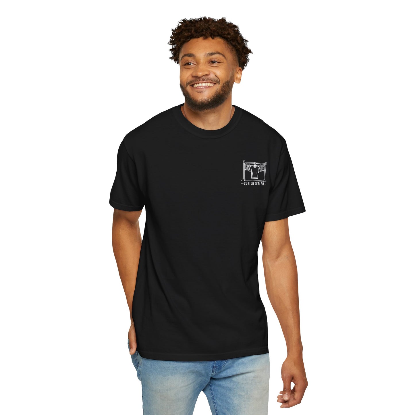 Model wearing the black Cotton Dealer merch crew T-shirt with a white chest graphic.