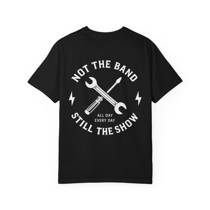 Back of a black Still the Show T-shirt with white Not the Band lettering and crossed crew tools.