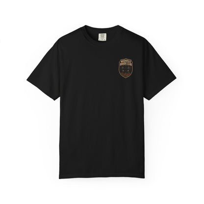 Front of a black Night Drive Division T-shirt with an amber Nashville Roadie Club tour bus badge on the left chest.